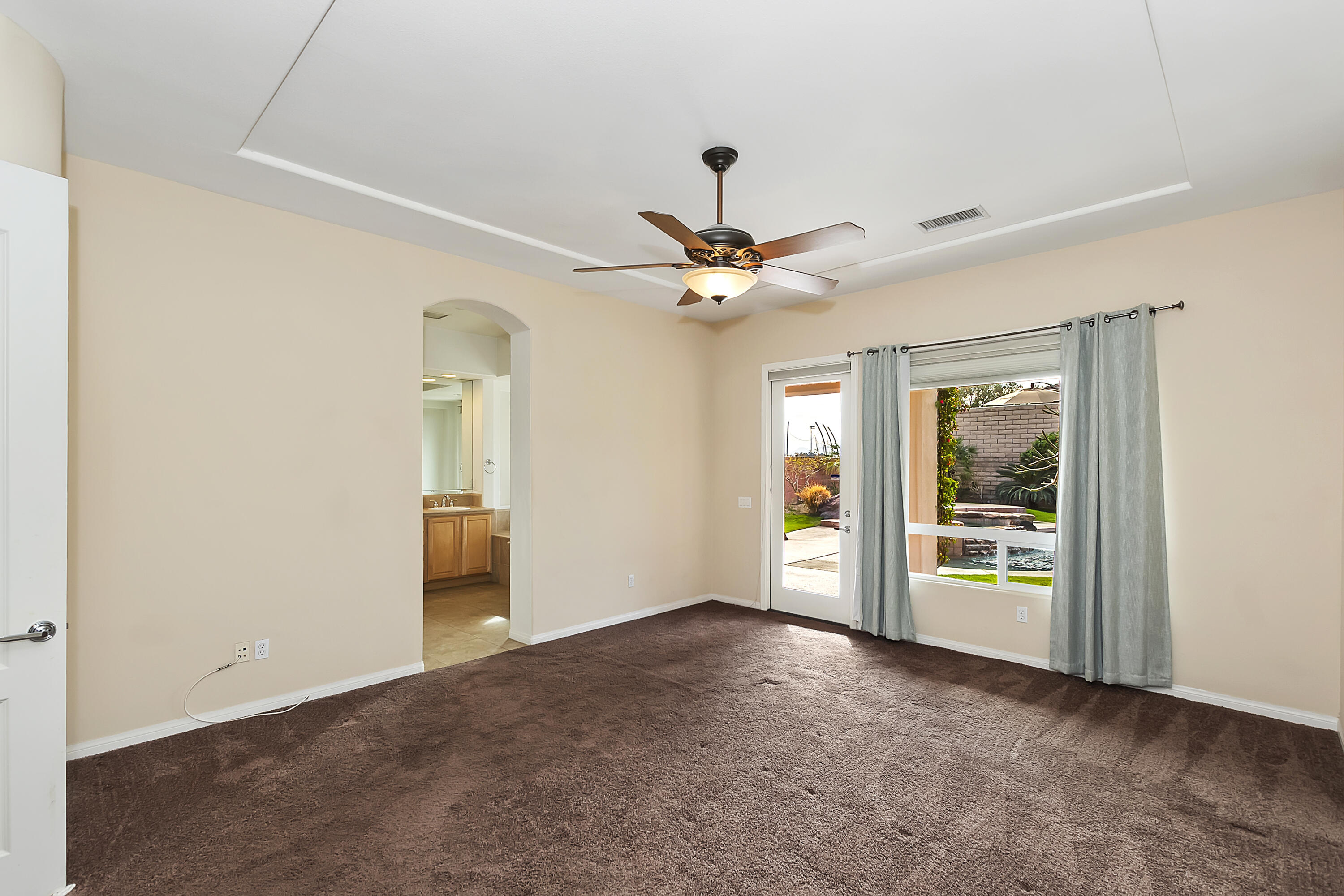 134 Via Tuscany Rancho Mirage, CA 92270 - Photo 28 of 44 a view of an empty room with a window