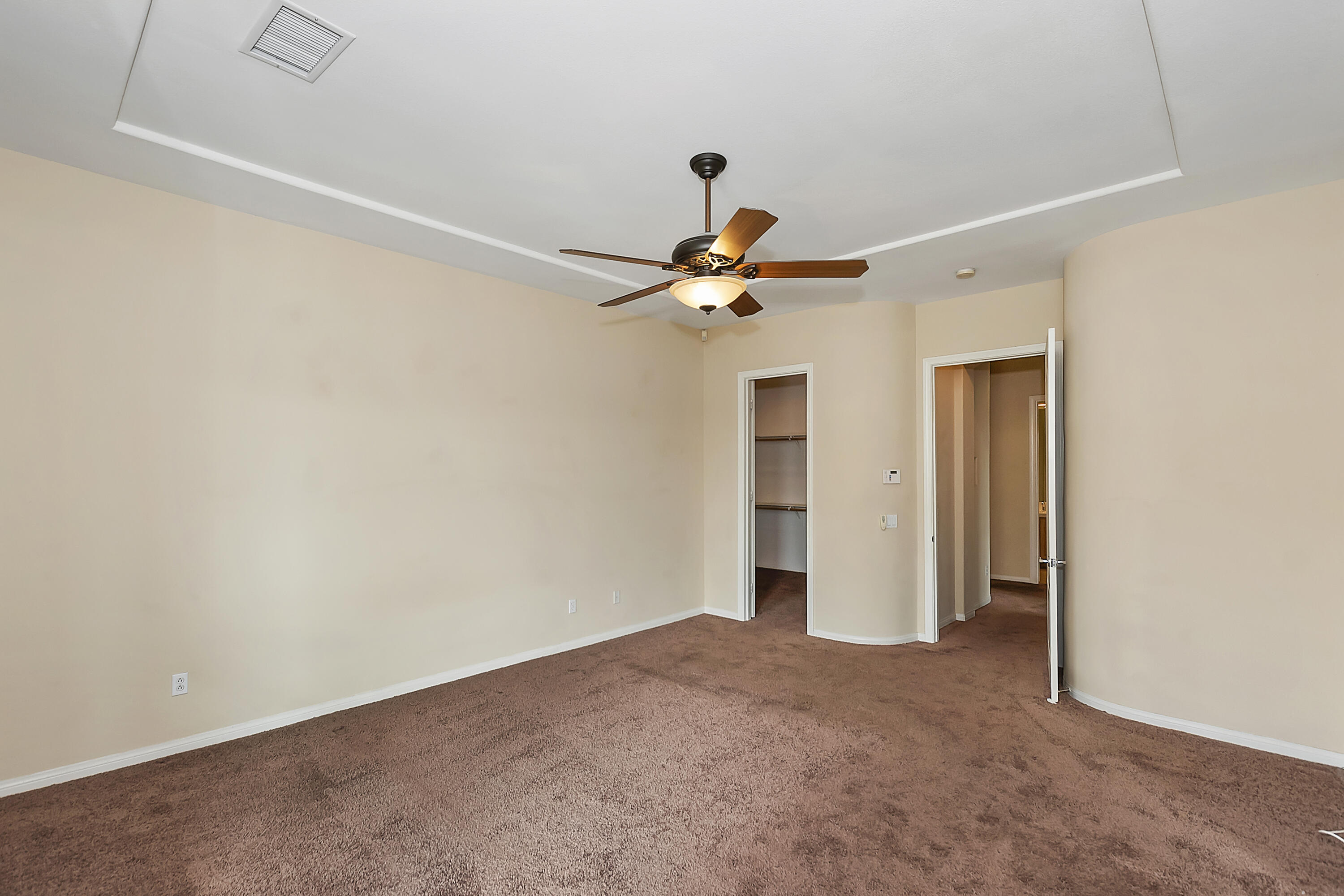 134 Via Tuscany Rancho Mirage, CA 92270 - Photo 29 of 44 a view of a livingroom with a ceiling fan and window
