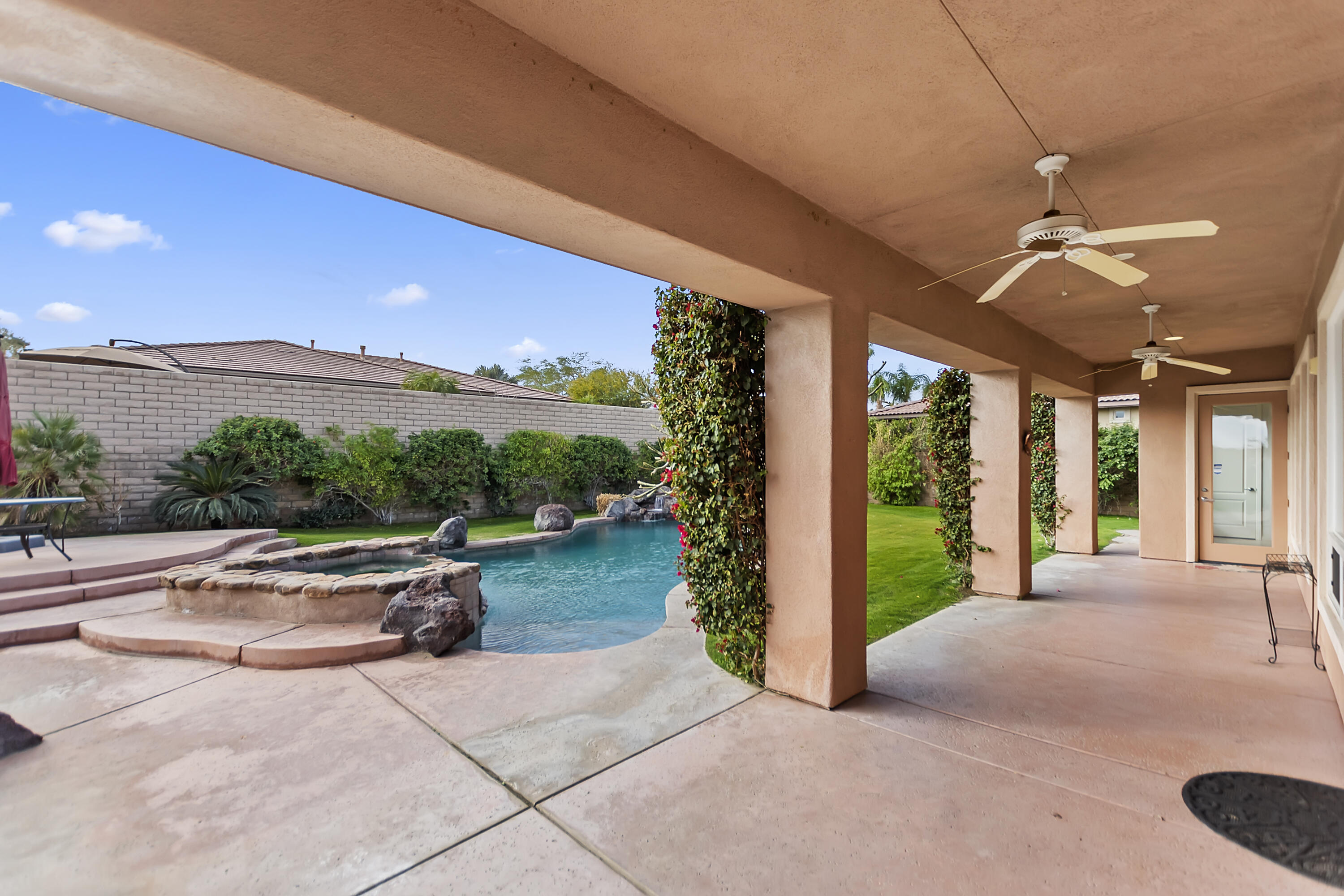 134 Via Tuscany Rancho Mirage, CA 92270 - Photo 33 of 44 a view of a porch with furniture and garden