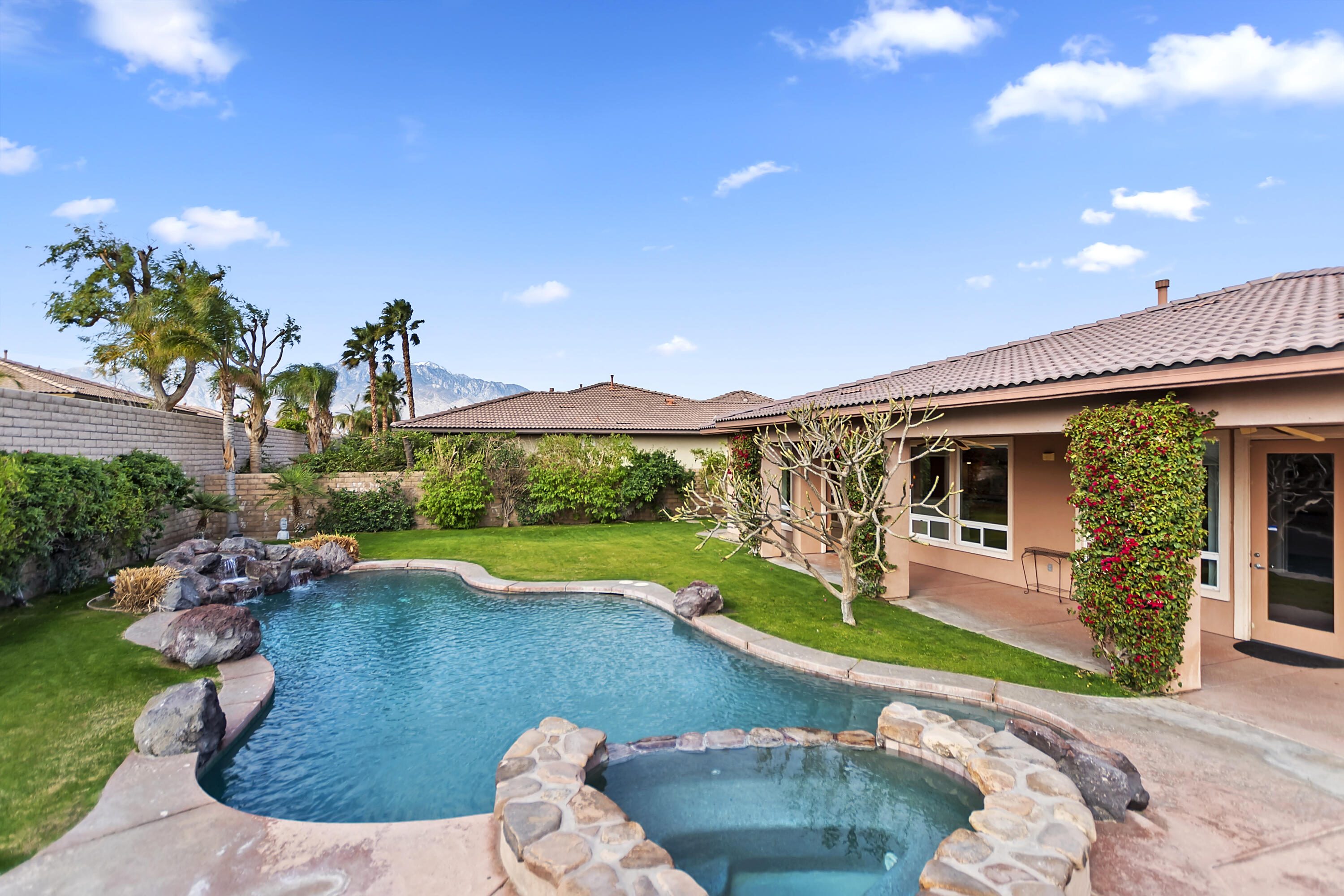 134 Via Tuscany Rancho Mirage, CA 92270 - Photo 34 of 44 a view of a house with swimming pool yard and patio