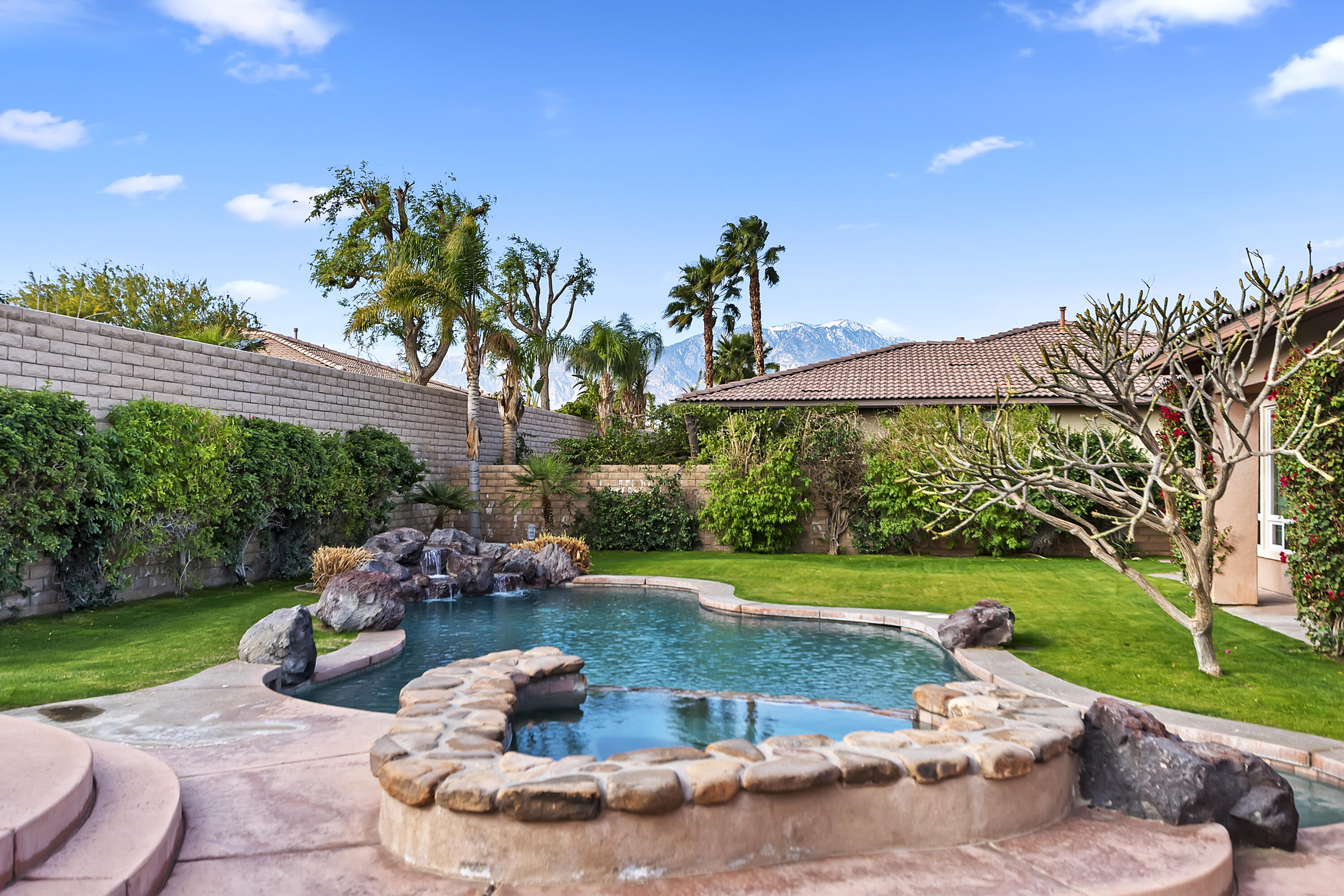 134 Via Tuscany Rancho Mirage, CA 92270 - Photo 35 of 44 a front view of a house with garden