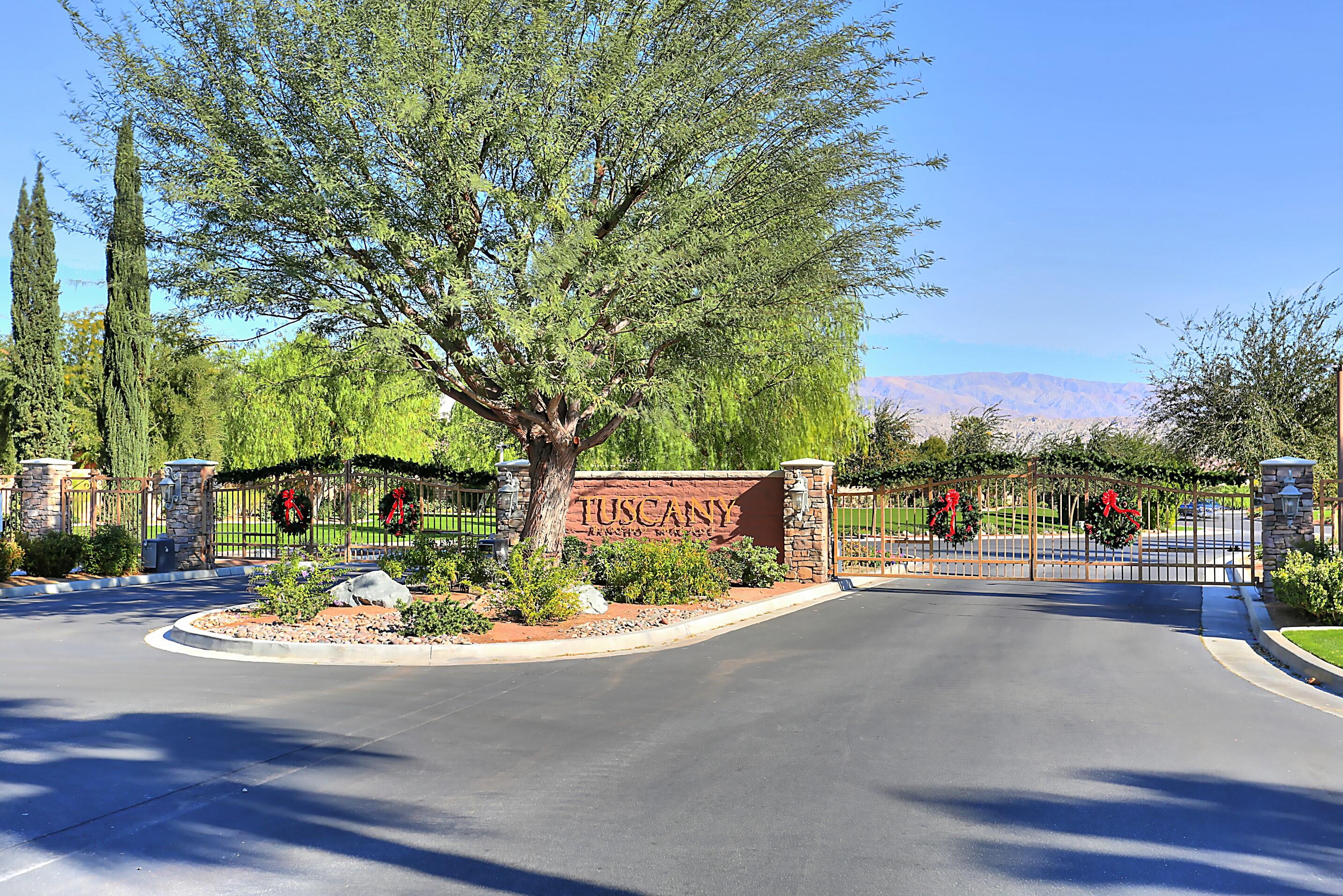 134 Via Tuscany Rancho Mirage, CA 92270 - Photo 40 of 44 a street view with sitting space and trees
