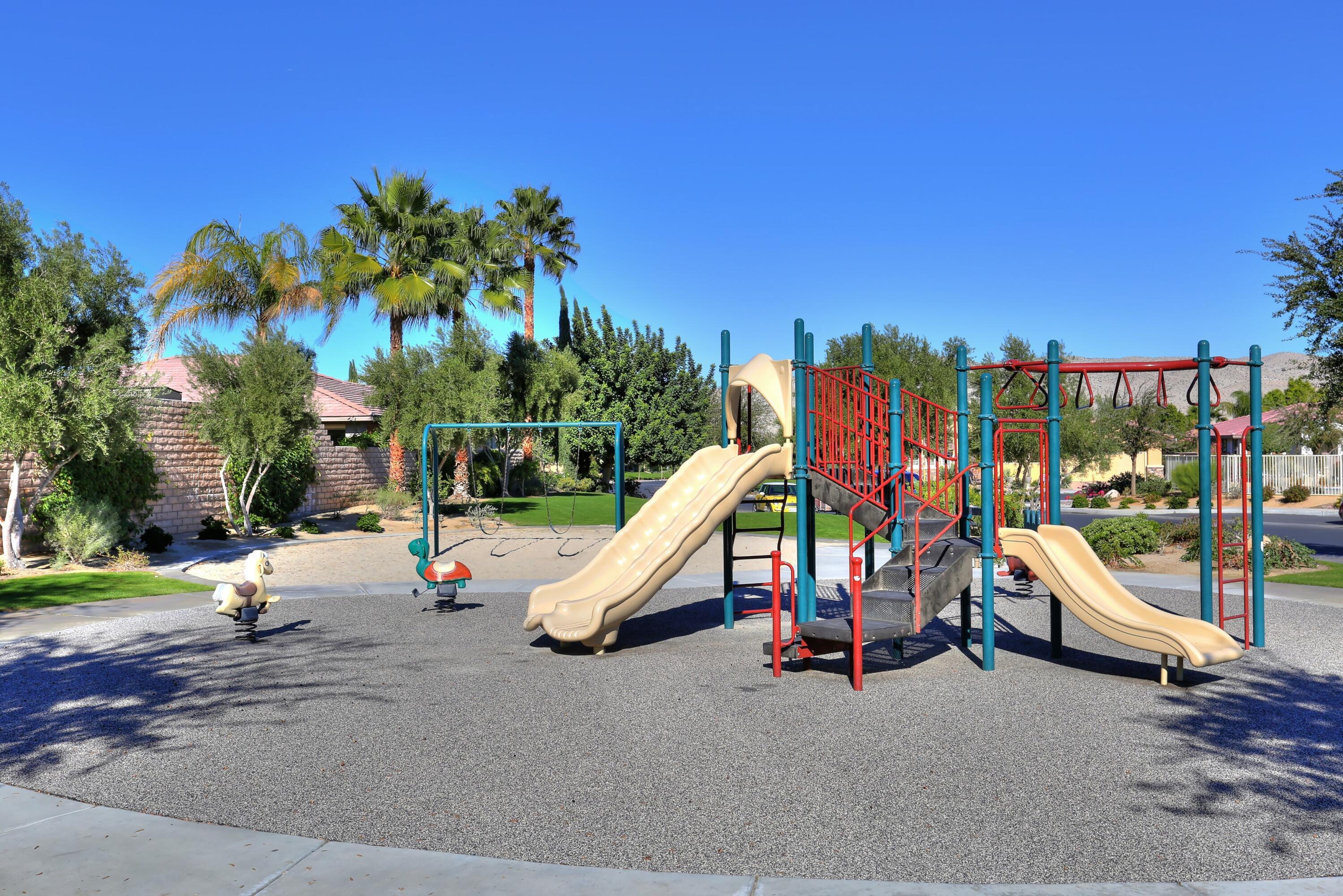134 Via Tuscany Rancho Mirage, CA 92270 - Photo 41 of 44 a view of a park with slide