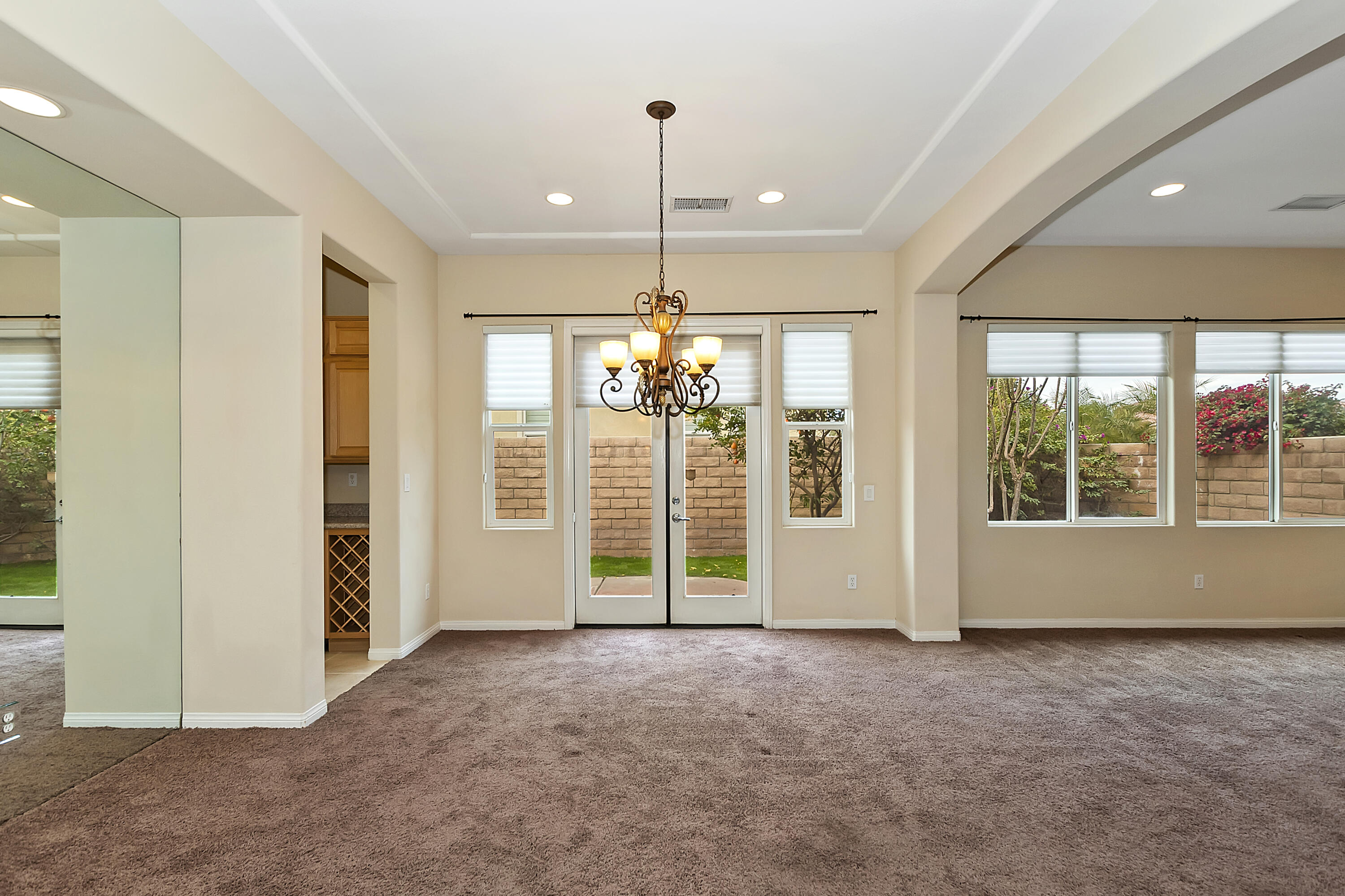 134 Via Tuscany Rancho Mirage, CA 92270 - Photo 5 of 44 a view of a livingroom with a chandelier fan and windows