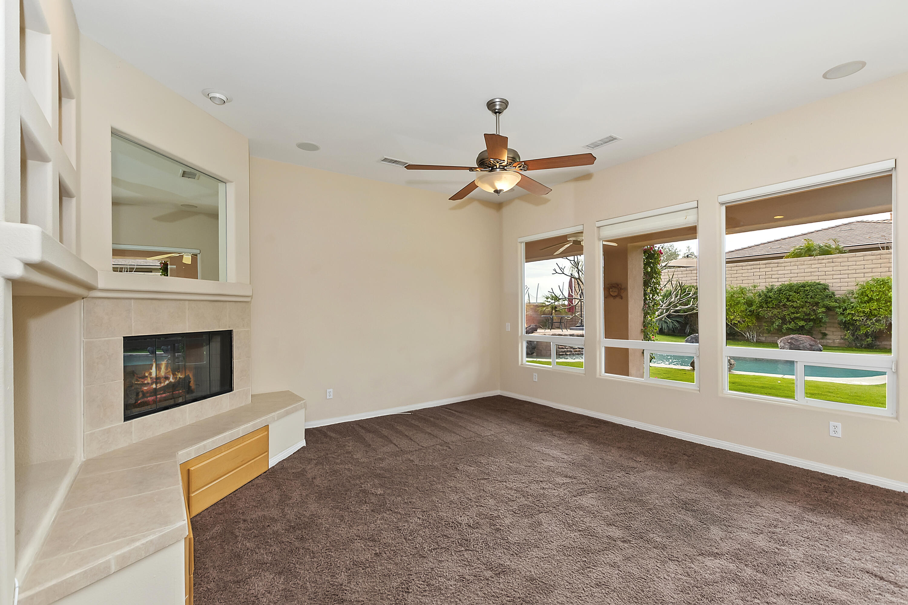 134 Via Tuscany Rancho Mirage, CA 92270 - Photo 7 of 44 a living room with furniture and a fireplace