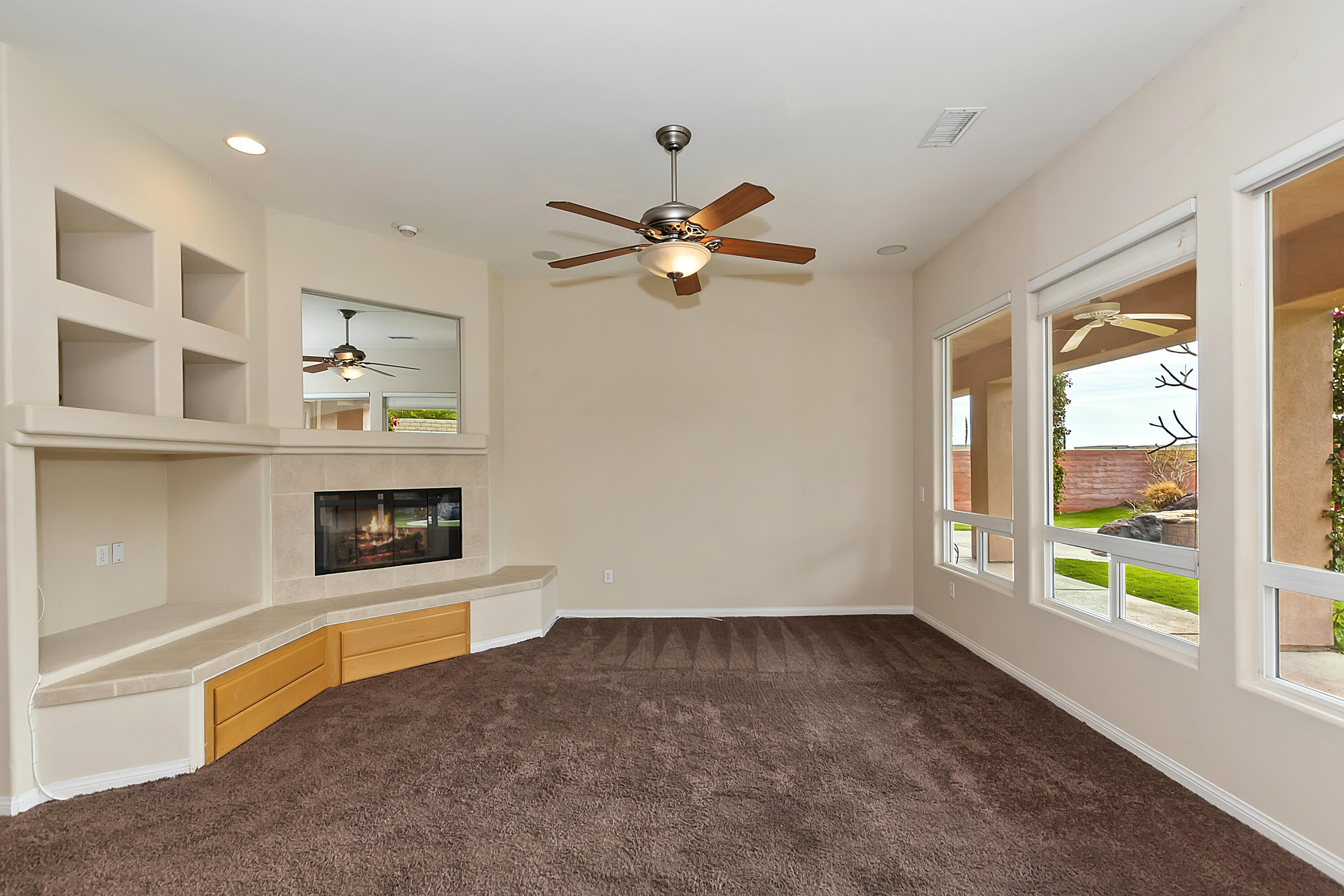 134 Via Tuscany Rancho Mirage, CA 92270 - Photo 8 of 44 a living room with furniture and a fireplace