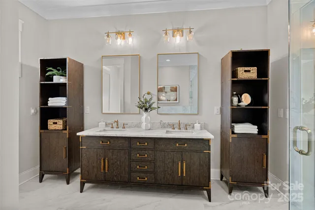 a bathroom with a double vanity sink and a mirror