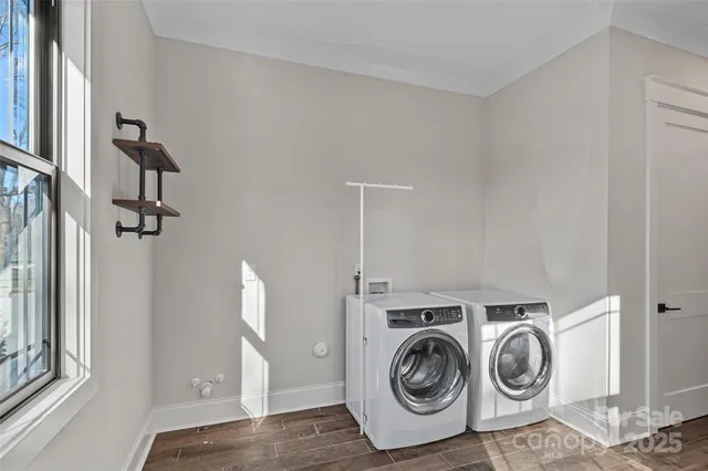 a view of storage and utility room with washer and dryer