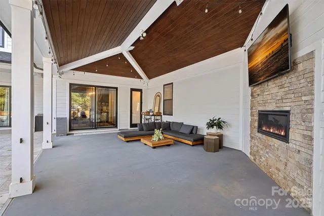 a view of a livingroom with furniture and a fireplace