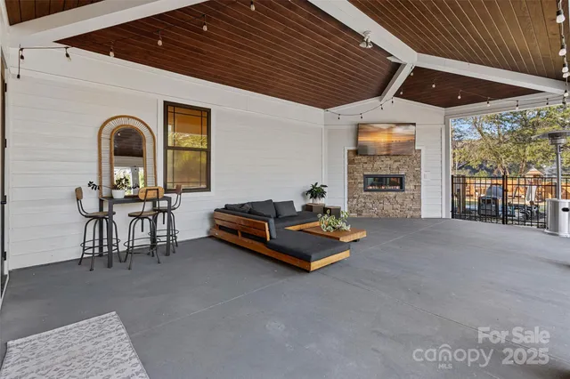 a livingroom with furniture and a fireplace