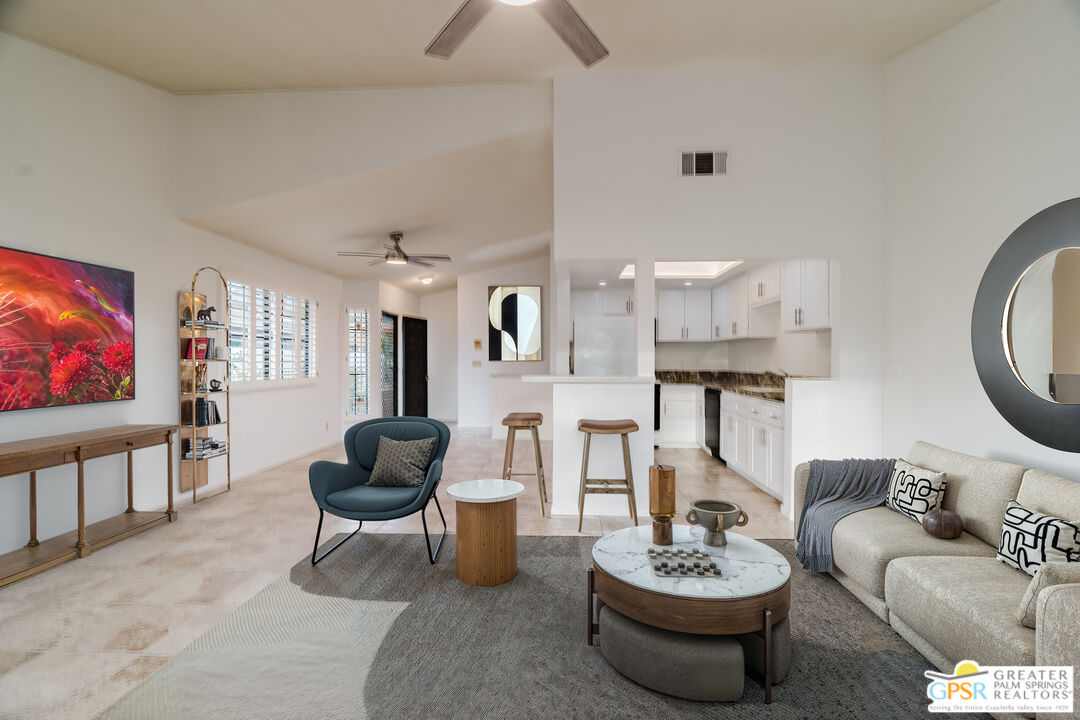 46400 Ryway Place, Unit 10 Palm Desert, CA 92260 - Photo 1 of 48 a living room with furniture and a flat screen tv