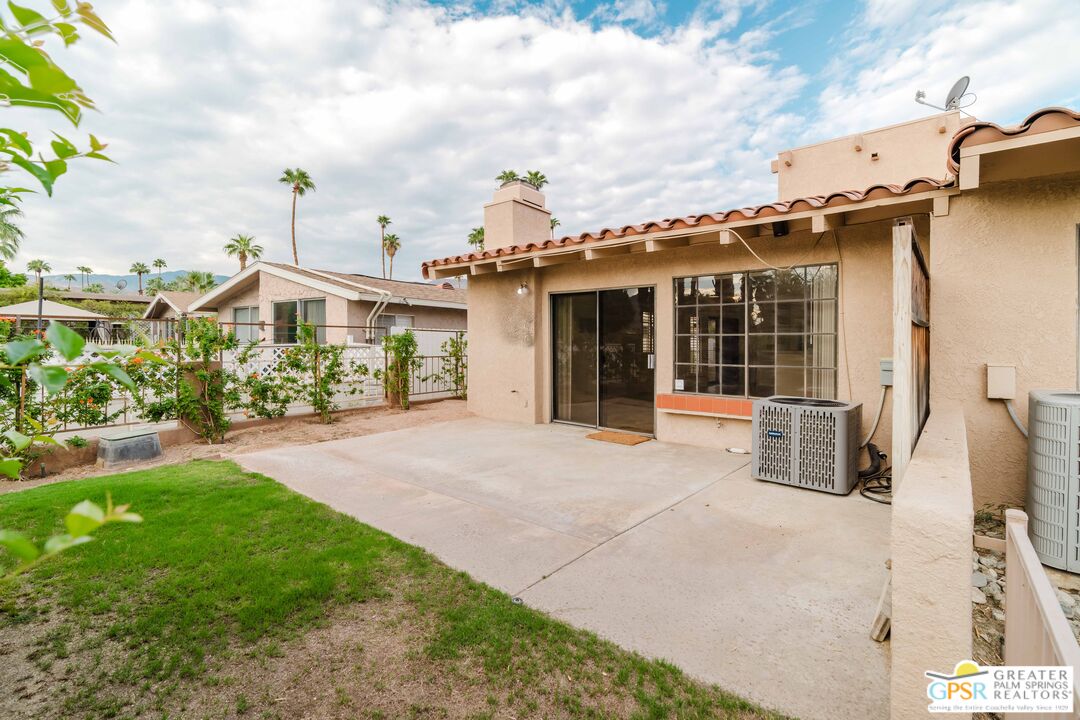 46400 Ryway Place, Unit 10 Palm Desert, CA 92260 - Photo 11 of 48 a front view of a house with garden
