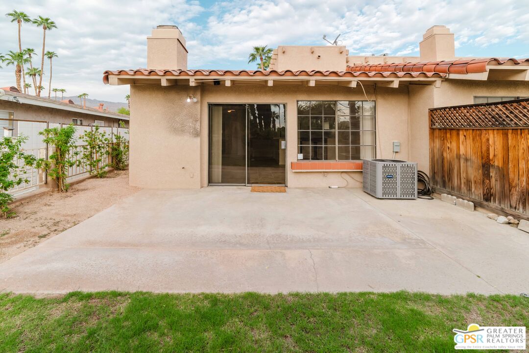 46400 Ryway Place, Unit 10 Palm Desert, CA 92260 - Photo 12 of 48 a view of a house with a patio and a garden