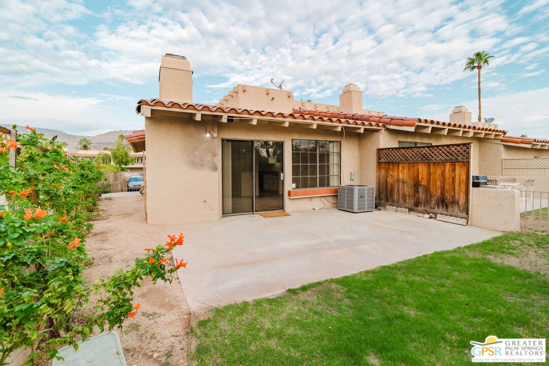 46400 Ryway Place, Unit 10 Palm Desert, CA 92260 - Photo 13 of 48 a view of a house with backyard and porch