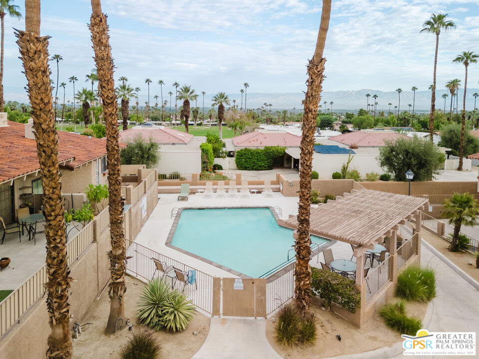 46400 Ryway Place, Unit 10 Palm Desert, CA 92260 - Photo 23 of 48 a terrace with outdoor seating and city view