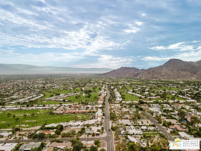 a view of a city with mountains in the background