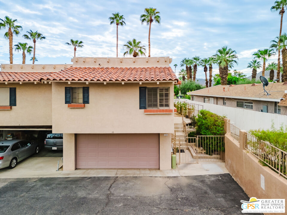 46400 Ryway Place, Unit 10 Palm Desert, CA 92260 - Photo 26 of 48 a view of a house with a balcony and potted plants
