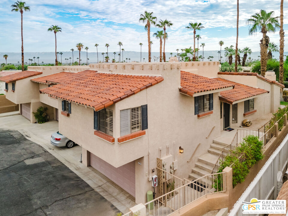 46400 Ryway Place, Unit 10 Palm Desert, CA 92260 - Photo 27 of 48 a aerial view of a house with a yard and potted plants