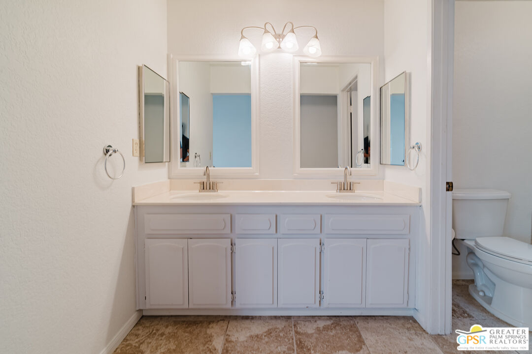46400 Ryway Place, Unit 10 Palm Desert, CA 92260 - Photo 28 of 48 a bathroom with a sink and a mirror