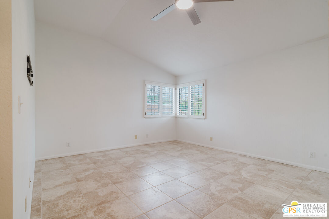 46400 Ryway Place, Unit 10 Palm Desert, CA 92260 - Photo 29 of 48 an empty room with a empty space and windows
