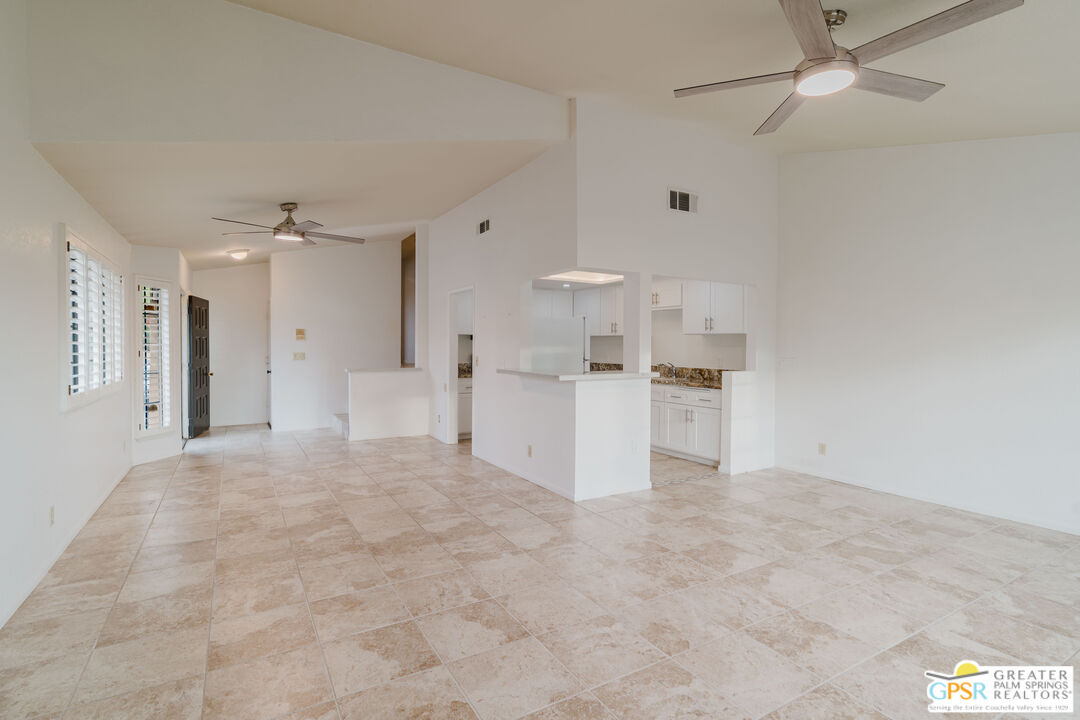 46400 Ryway Place, Unit 10 Palm Desert, CA 92260 - Photo 4 of 48 a view of kitchen with stainless steel appliances cabinets a sink and a refrigerator