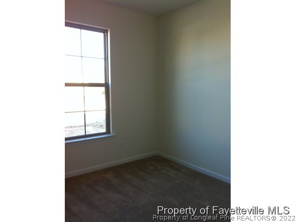 360 River Oak Street Spring Lake, NC 28390 - Photo 11 of 15 a view of an empty room with a window
