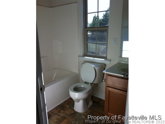 360 River Oak Street Spring Lake, NC 28390 - Photo 13 of 15 a bathroom with a toilet and a sink