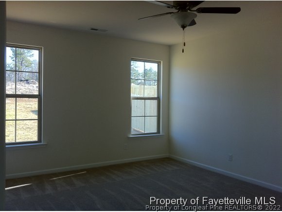 360 River Oak Street Spring Lake, NC 28390 - Photo 7 of 15 an empty room with windows