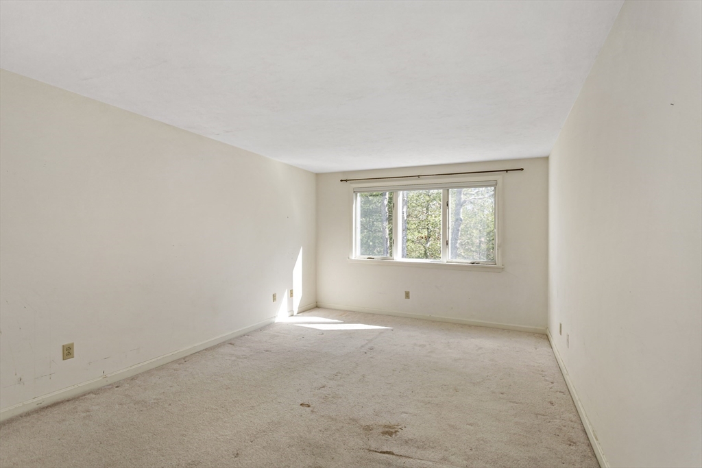 3 Kettle Lane, Unit 3 Mashpee, MA 02649 - Photo 14 of 24 an empty room with windows