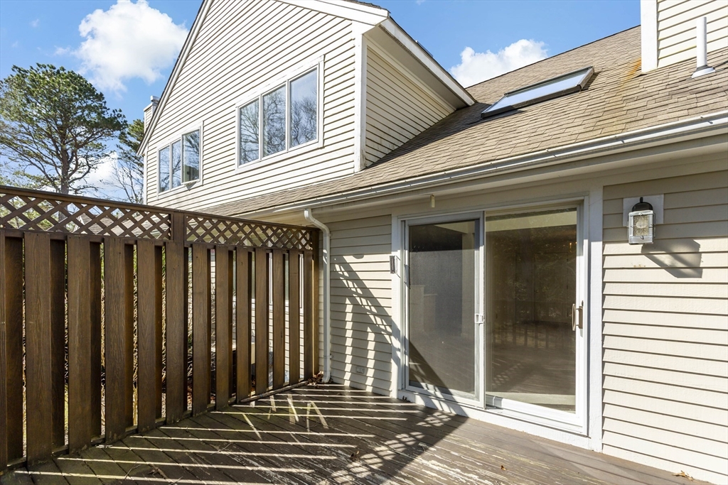 3 Kettle Lane, Unit 3 Mashpee, MA 02649 - Photo 17 of 24 a view of a house with a porch