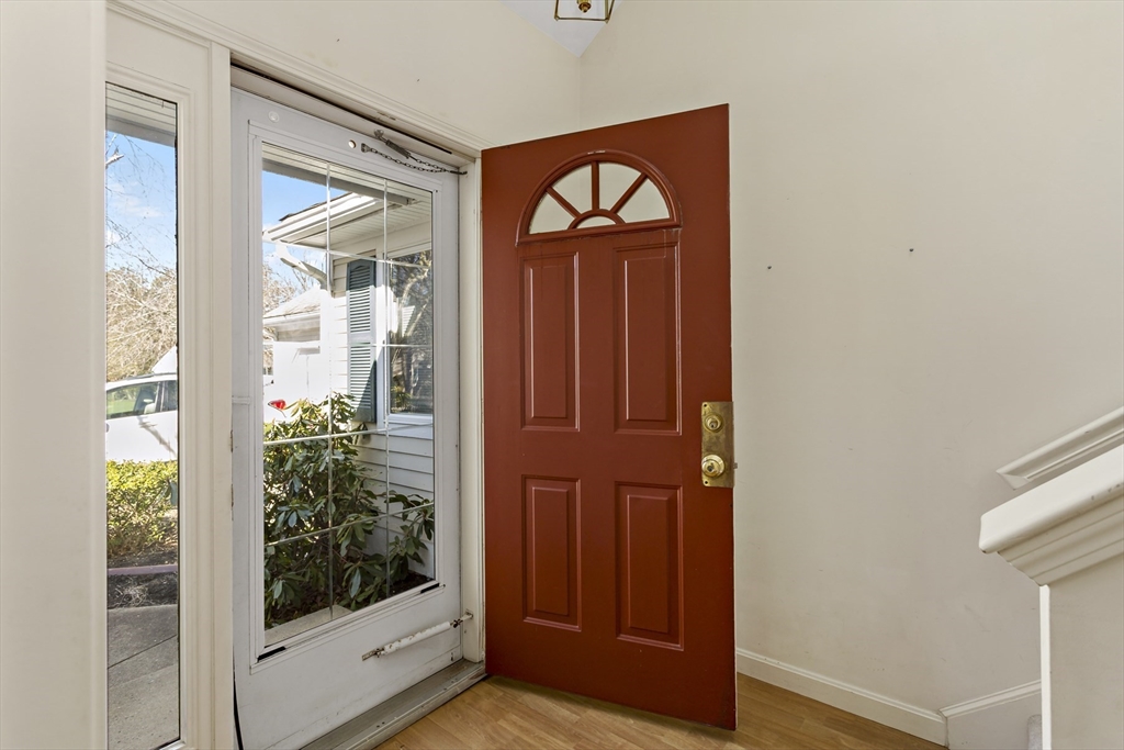 3 Kettle Lane, Unit 3 Mashpee, MA 02649 - Photo 4 of 24 a view of front door with wooden door