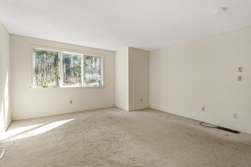 3 Kettle Lane, Unit 3 Mashpee, MA 02649 - Photo 10 of 24 an empty room with windows