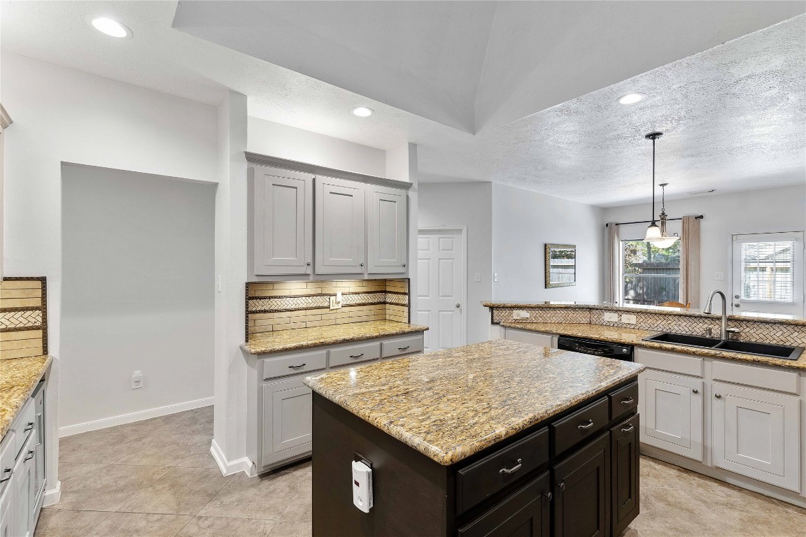 1707 Moston Drive Spring, TX 77386 - Photo 3 of 41 Kitchen with an island under a large skylight.