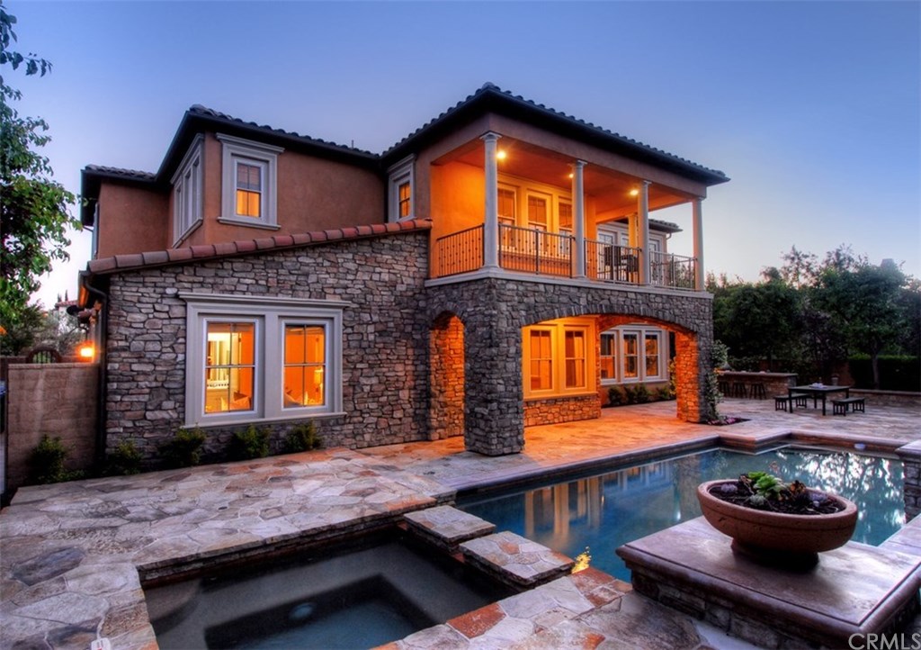 1 Moonlight Isle Ladera Ranch, CA 92694 - Photo 1 of 1 Backyard dusk view of pool & spa