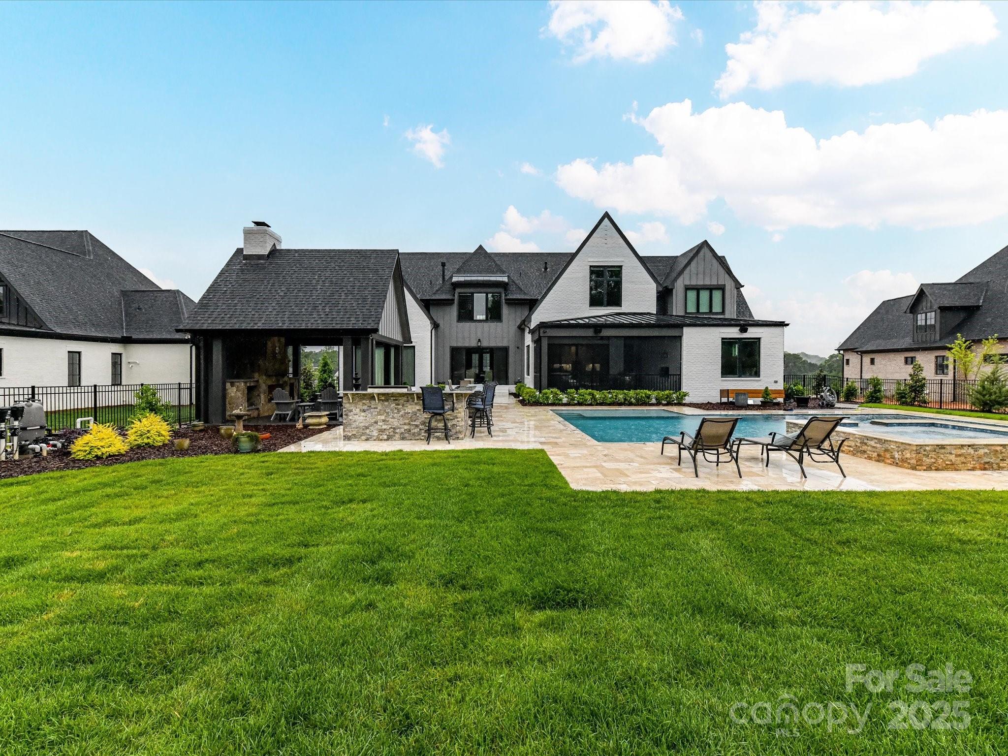 406 Sugar Maple Lane Weddington, NC 28104 - Photo 14 of 48 a front view of a house with swimming pool and porch with furniture