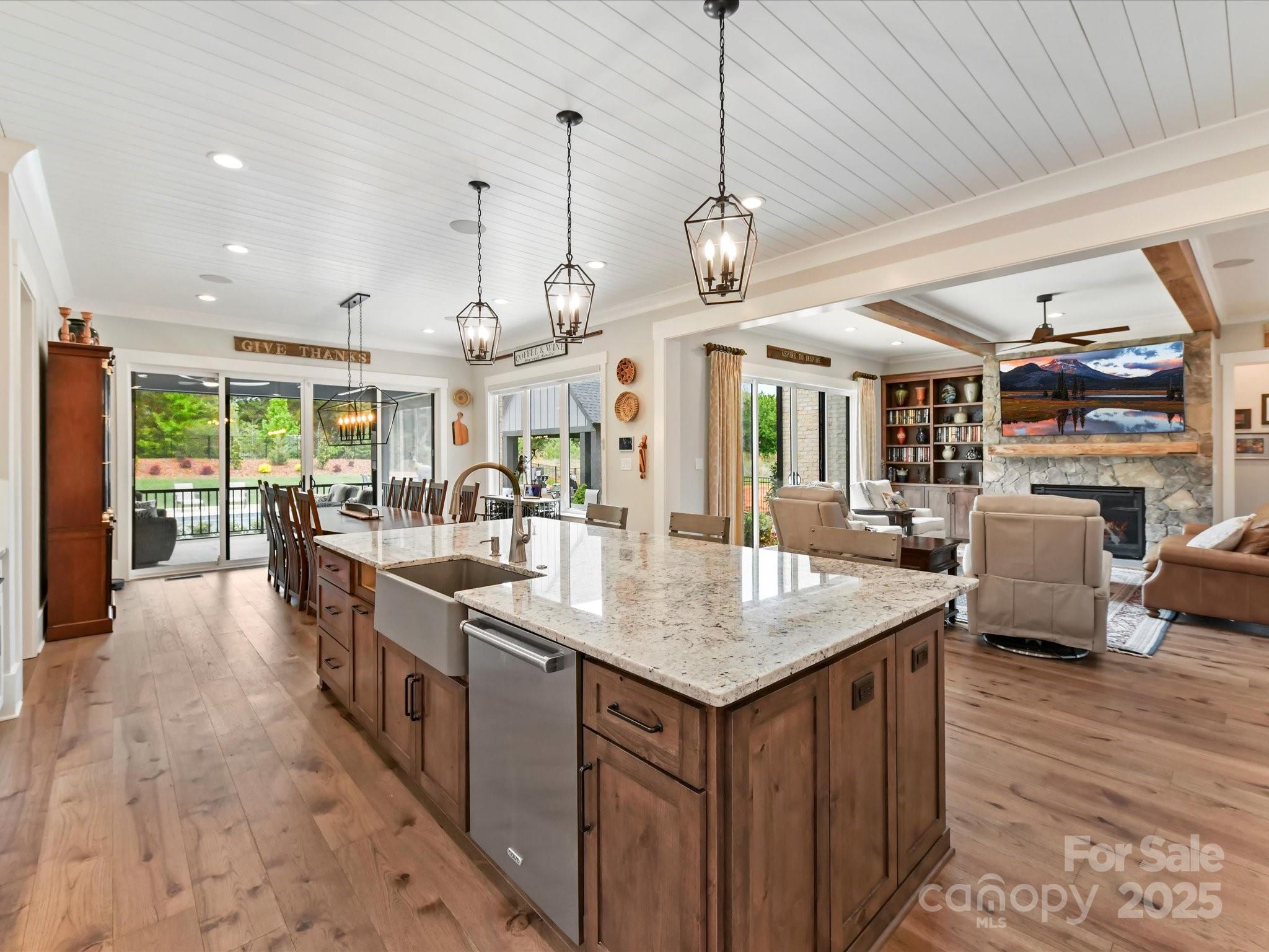 406 Sugar Maple Lane Weddington, NC 28104 - Photo 23 of 48 a large kitchen with lots of counter space and chandelier