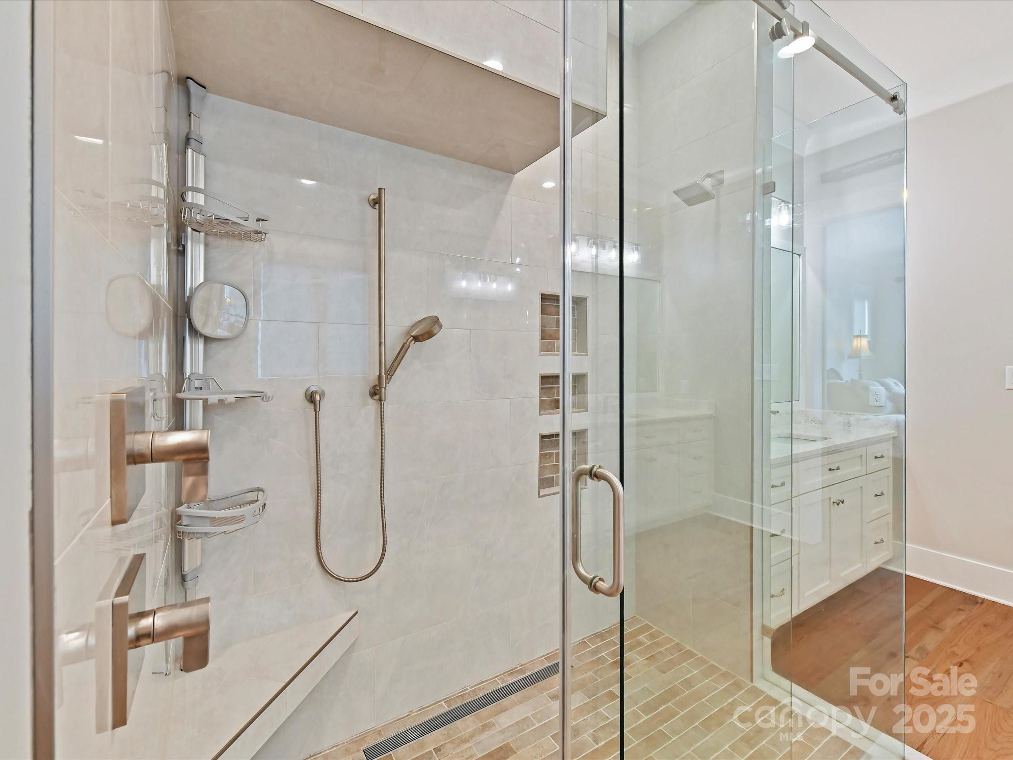 406 Sugar Maple Lane Weddington, NC 28104 - Photo 28 of 48 a bathroom with a glass shower door