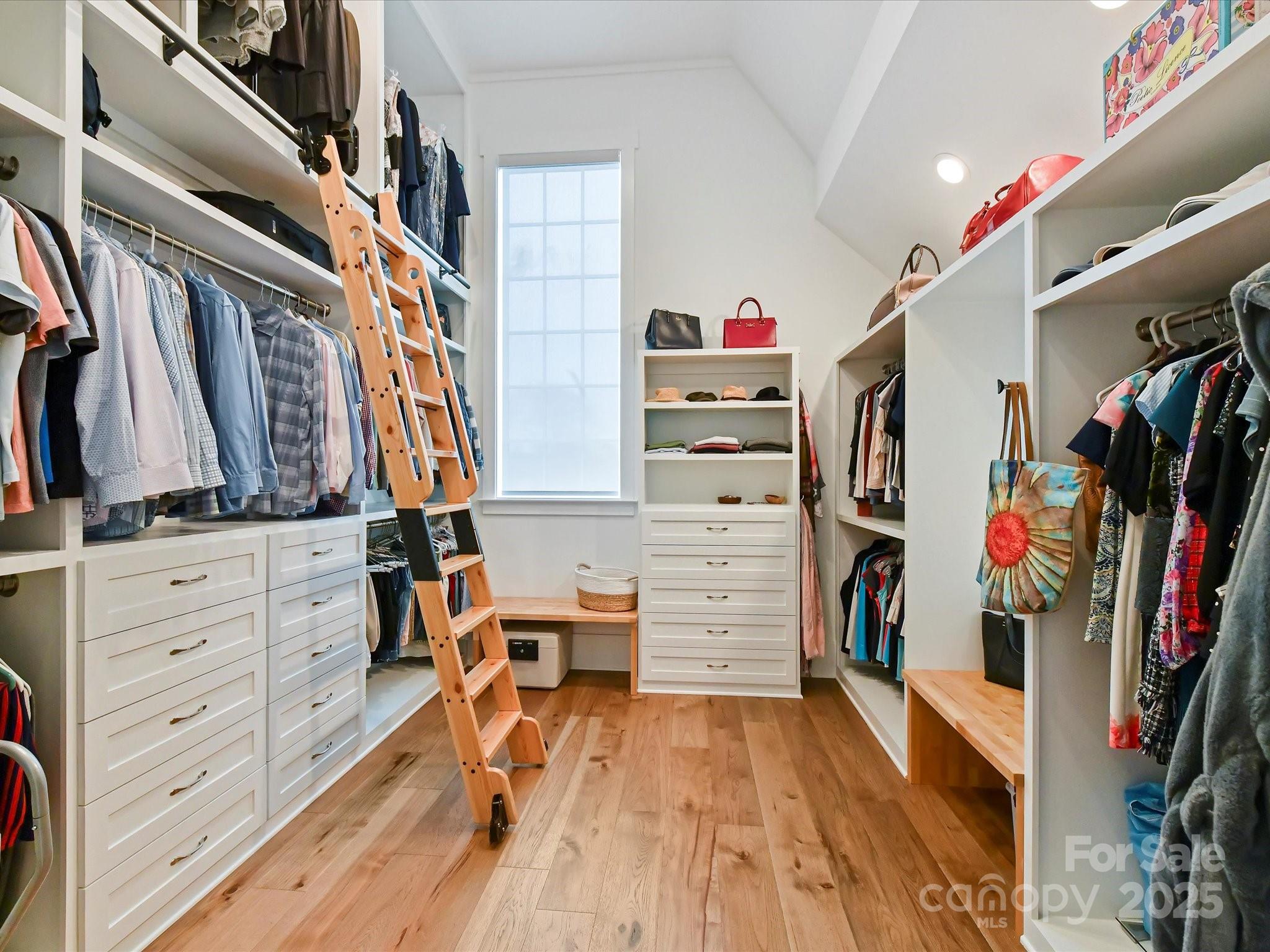406 Sugar Maple Lane Weddington, NC 28104 - Photo 29 of 48 a view of walk in closet with clothes and shoes