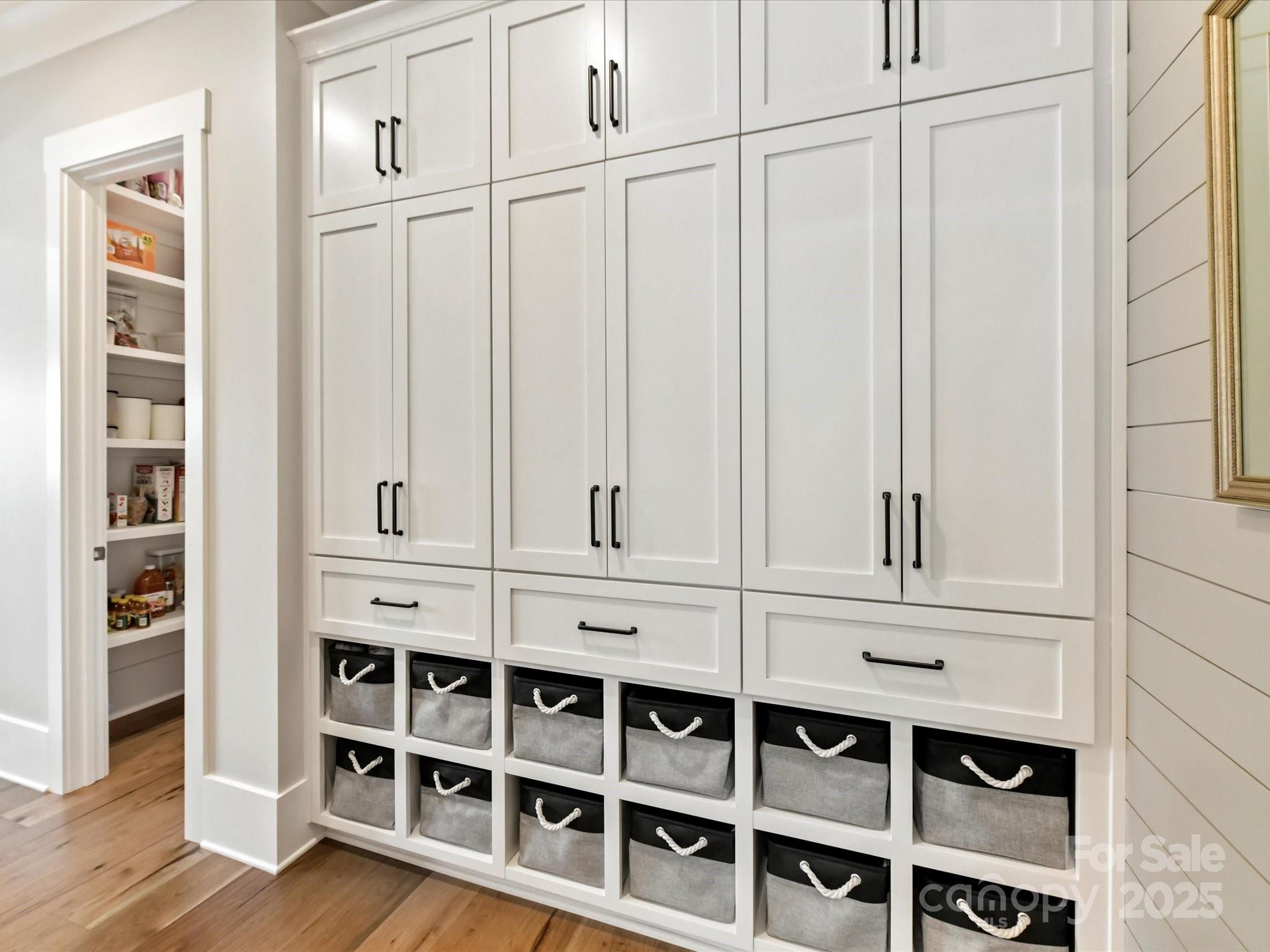 406 Sugar Maple Lane Weddington, NC 28104 - Photo 31 of 48 a view of white cabinets with wooden floor