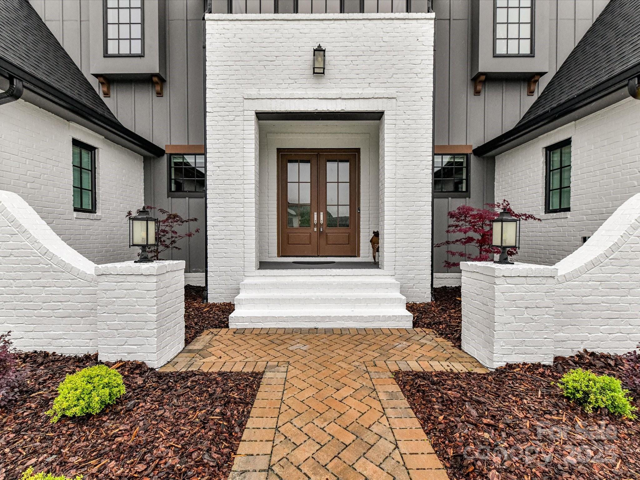 406 Sugar Maple Lane Weddington, NC 28104 - Photo 4 of 48 a front view of a house with garden
