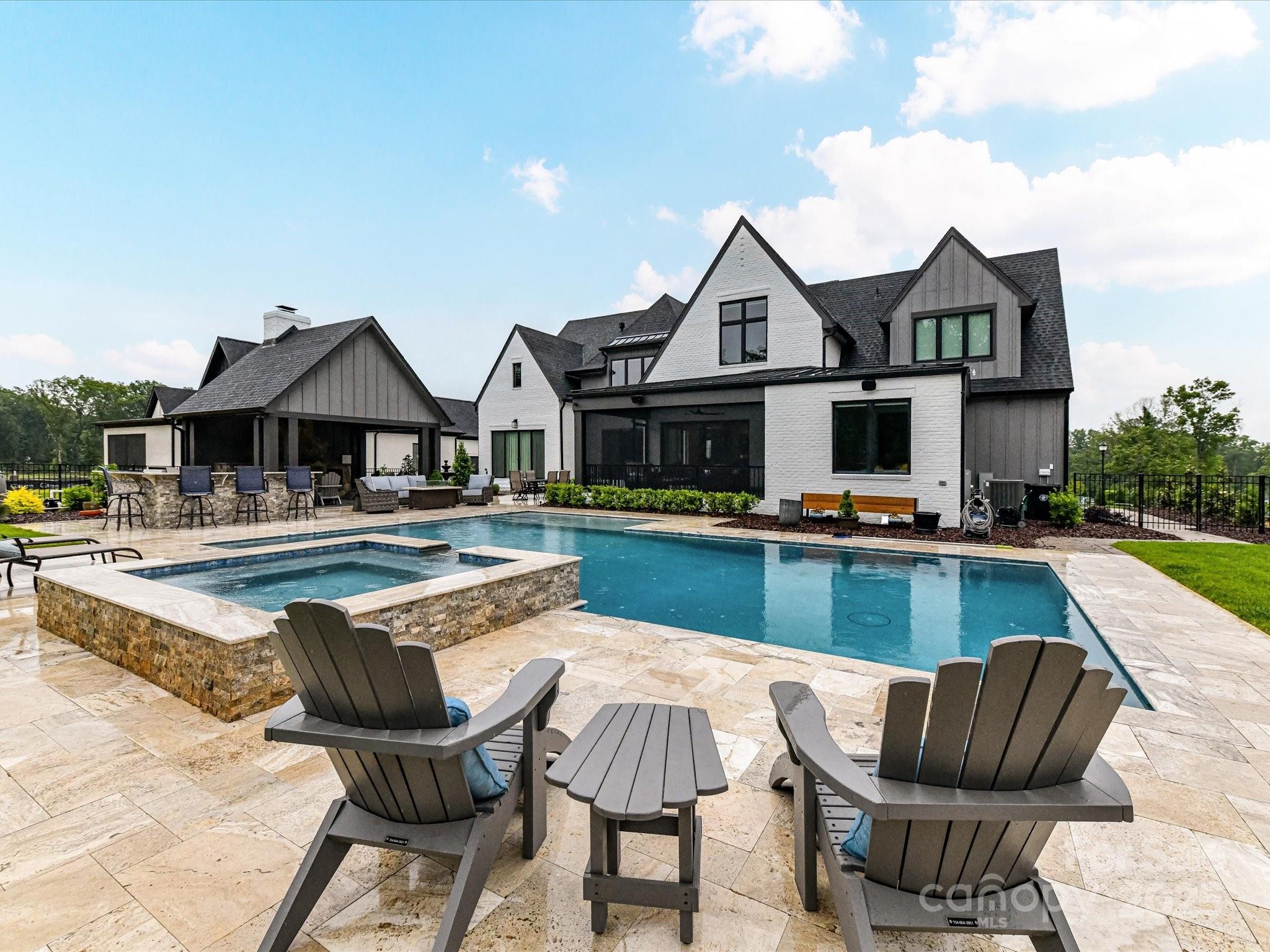 406 Sugar Maple Lane Weddington, NC 28104 - Photo 8 of 48 a view of a house with swimming pool and sitting area