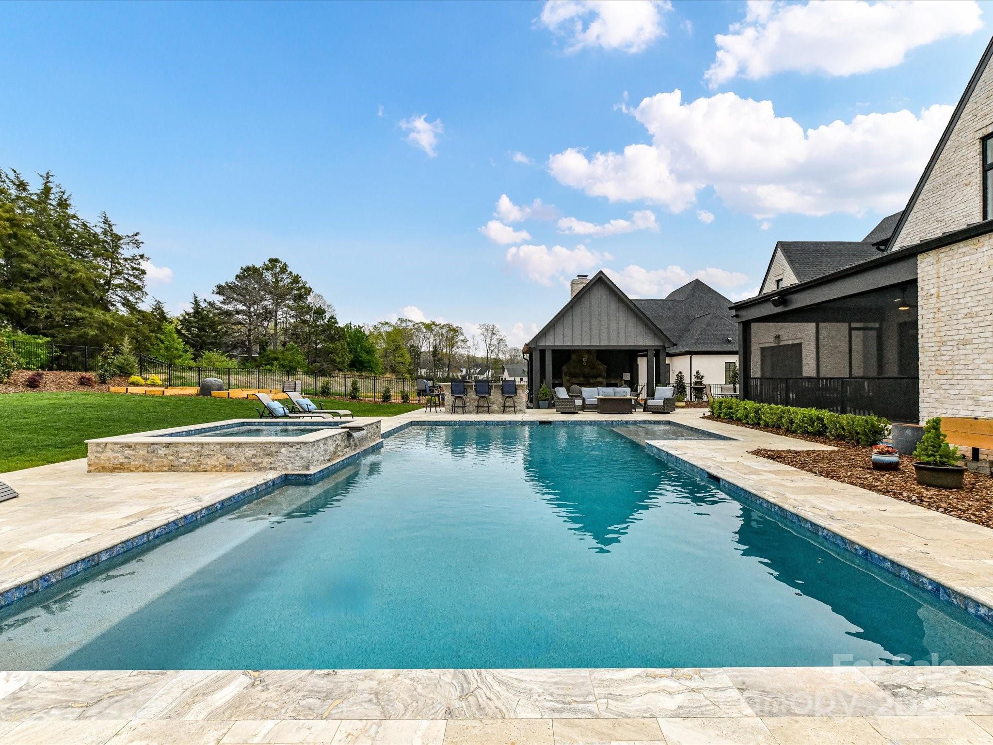 406 Sugar Maple Lane Weddington, NC 28104 - Photo 10 of 48 a view of a house with swimming pool and a yard