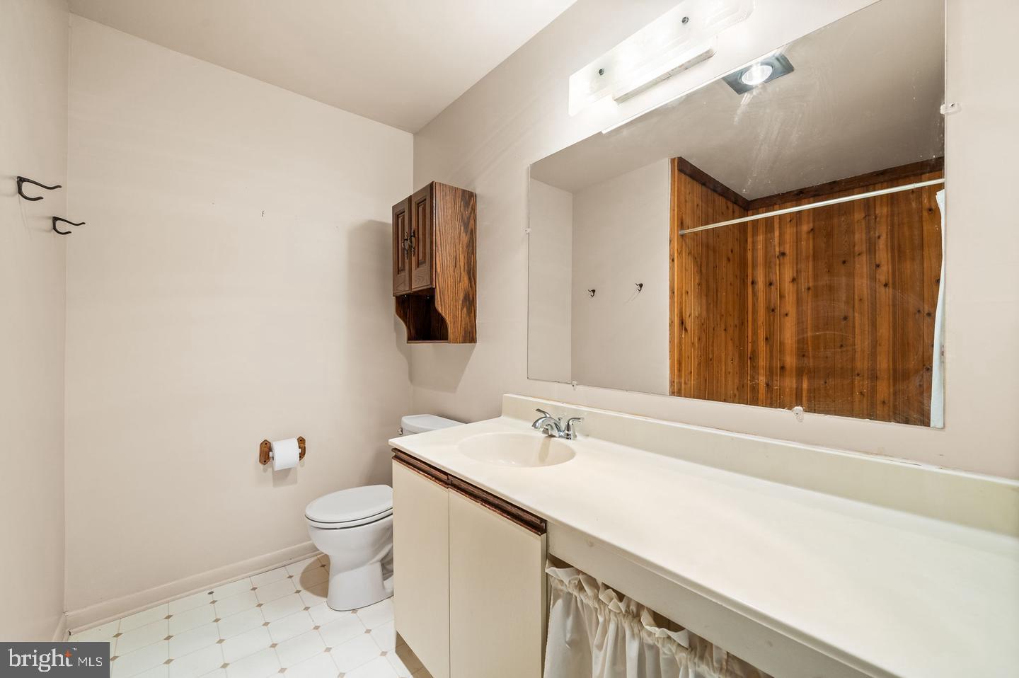 113 Spring Lane, Unit 7 West Chester, PA 19382 - Photo 14 of 18 a bathroom with a sink toilet and shower