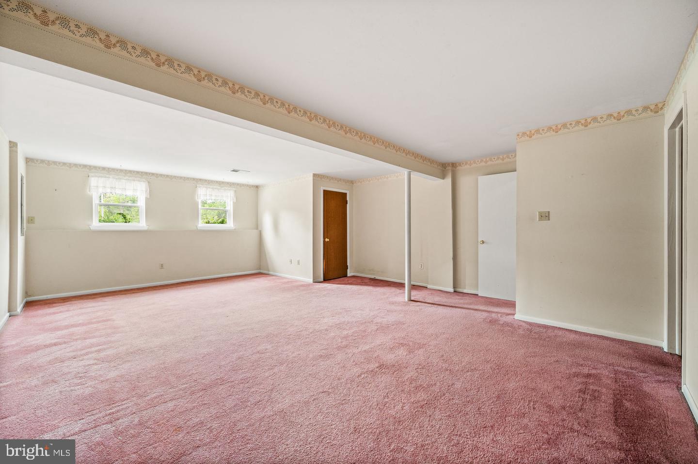 113 Spring Lane, Unit 7 West Chester, PA 19382 - Photo 15 of 18 a view of an empty room with a window