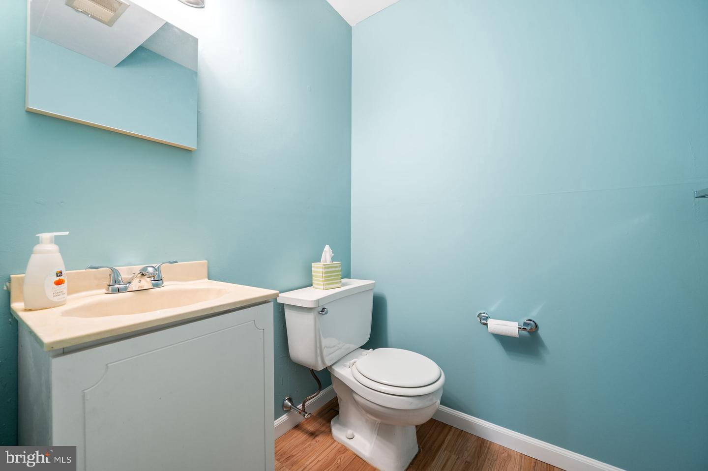 113 Spring Lane, Unit 7 West Chester, PA 19382 - Photo 16 of 18 a bathroom with a sink a toilet and a mirror