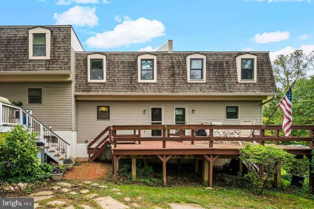 a aerial view of a house with a swimming pool and sitting area