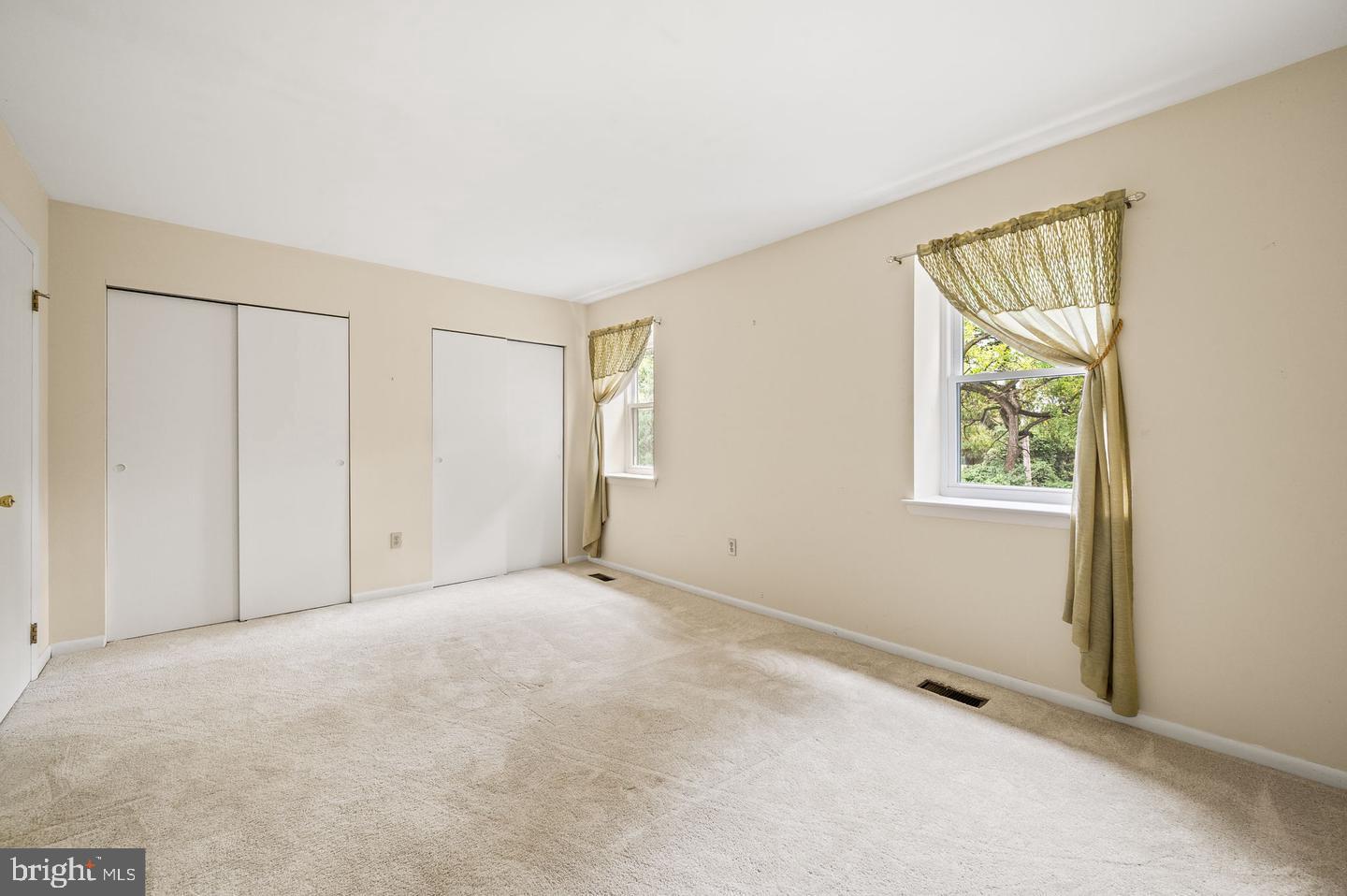 113 Spring Lane, Unit 7 West Chester, PA 19382 - Photo 9 of 18 a view of an empty room with a window