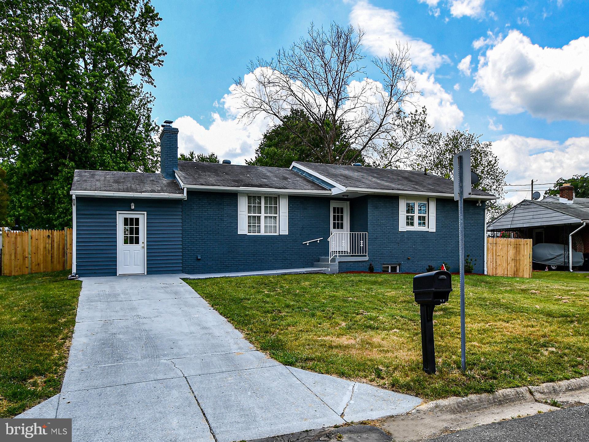 9303 Small Drive Clinton, MD 20735 - Photo 1 of 48 a front view of a house with garden