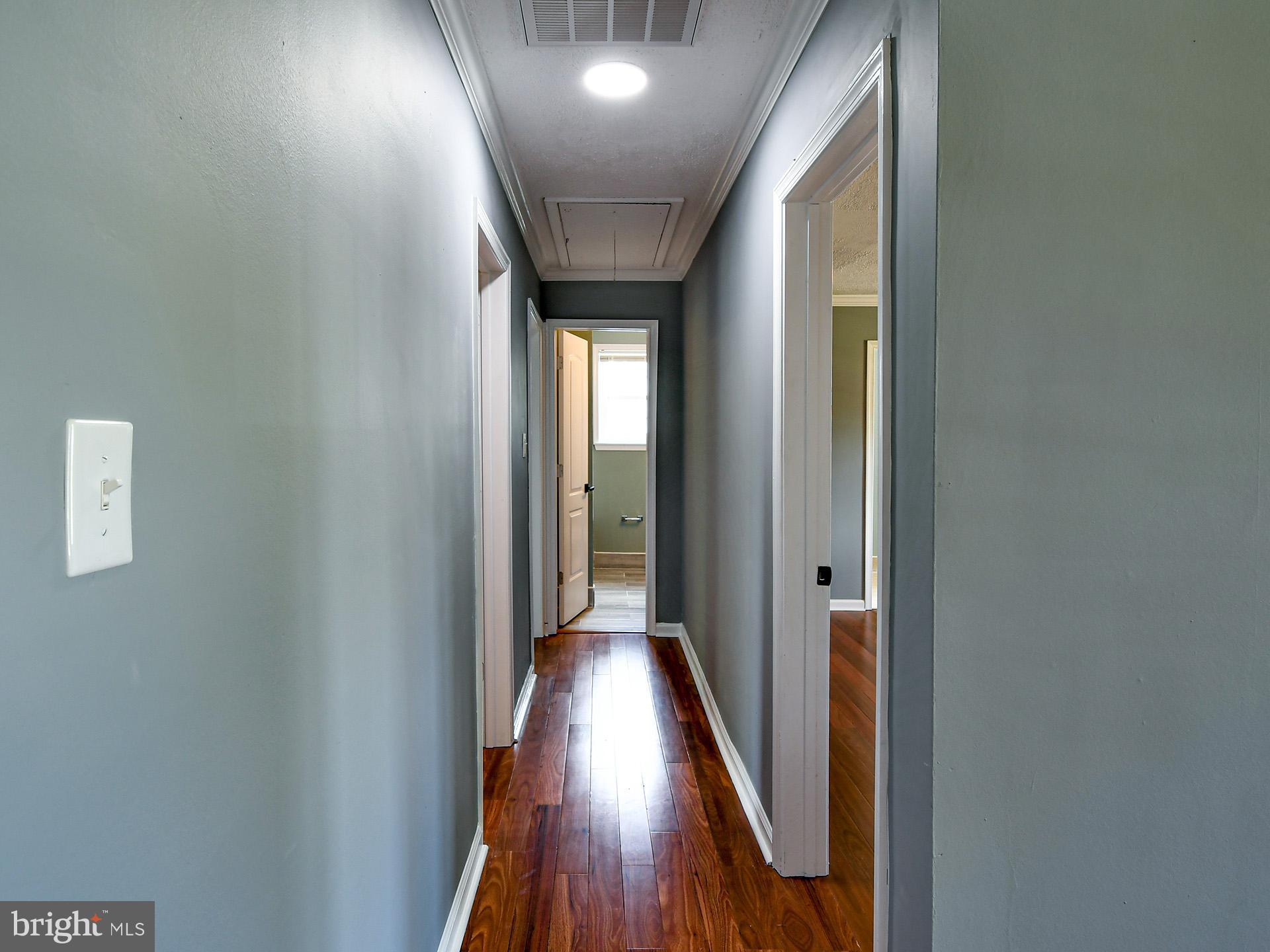 9303 Small Drive Clinton, MD 20735 - Photo 14 of 48 a view of hallway with wooden floor