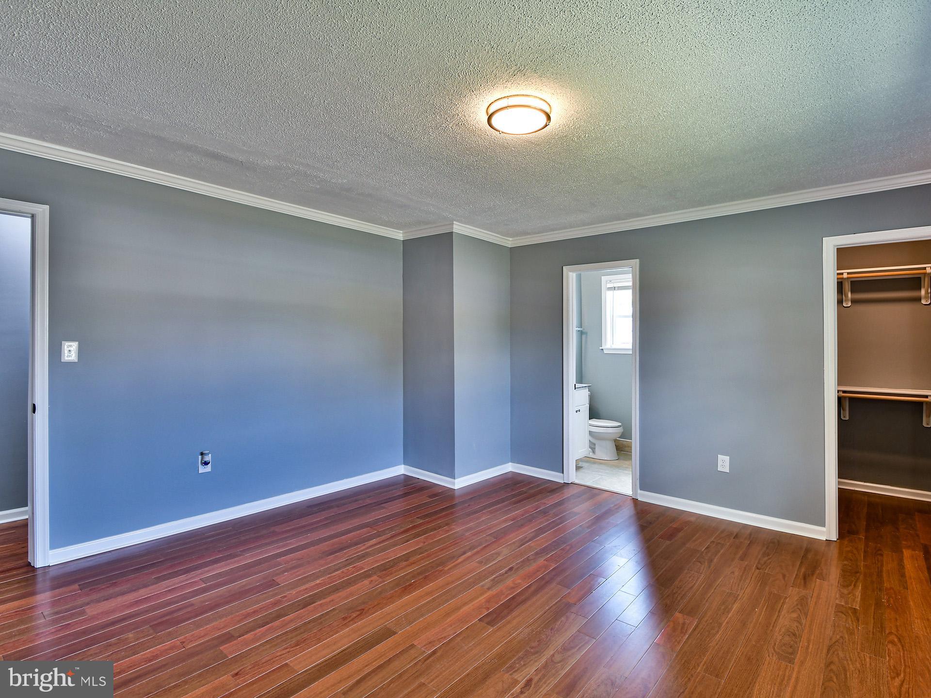 9303 Small Drive Clinton, MD 20735 - Photo 16 of 48 wooden floor in an empty room with a window